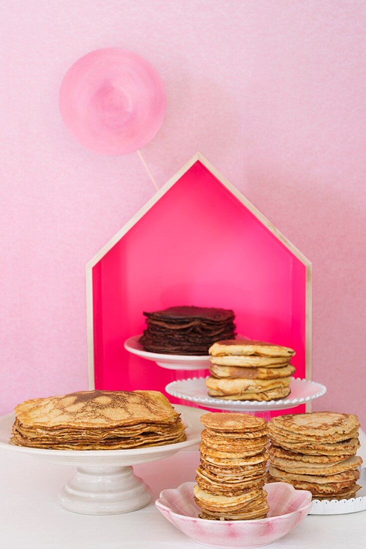 An arrangement of pancakes including chocolate pancakes