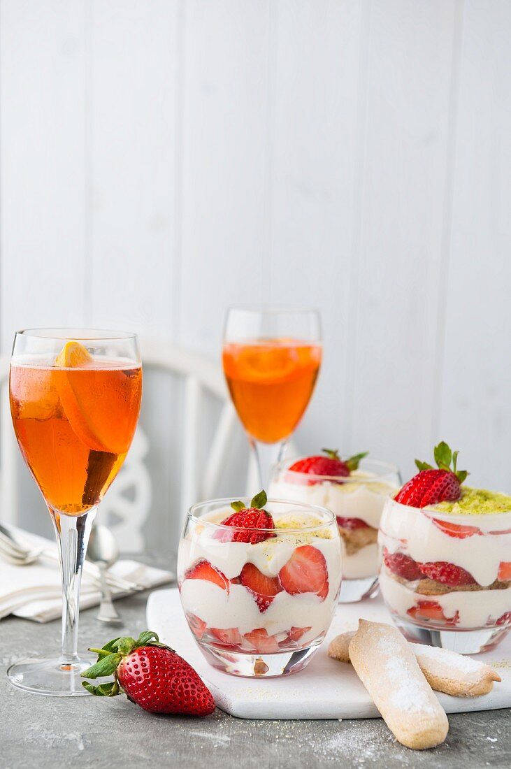 Strawberry tiramisu and orange cocktails
