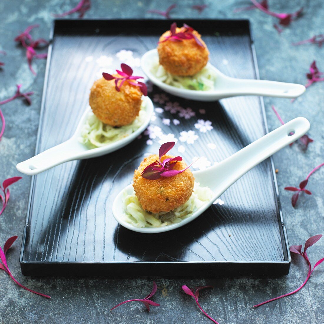 Mini crab cakes on cabbage salad (Asia)