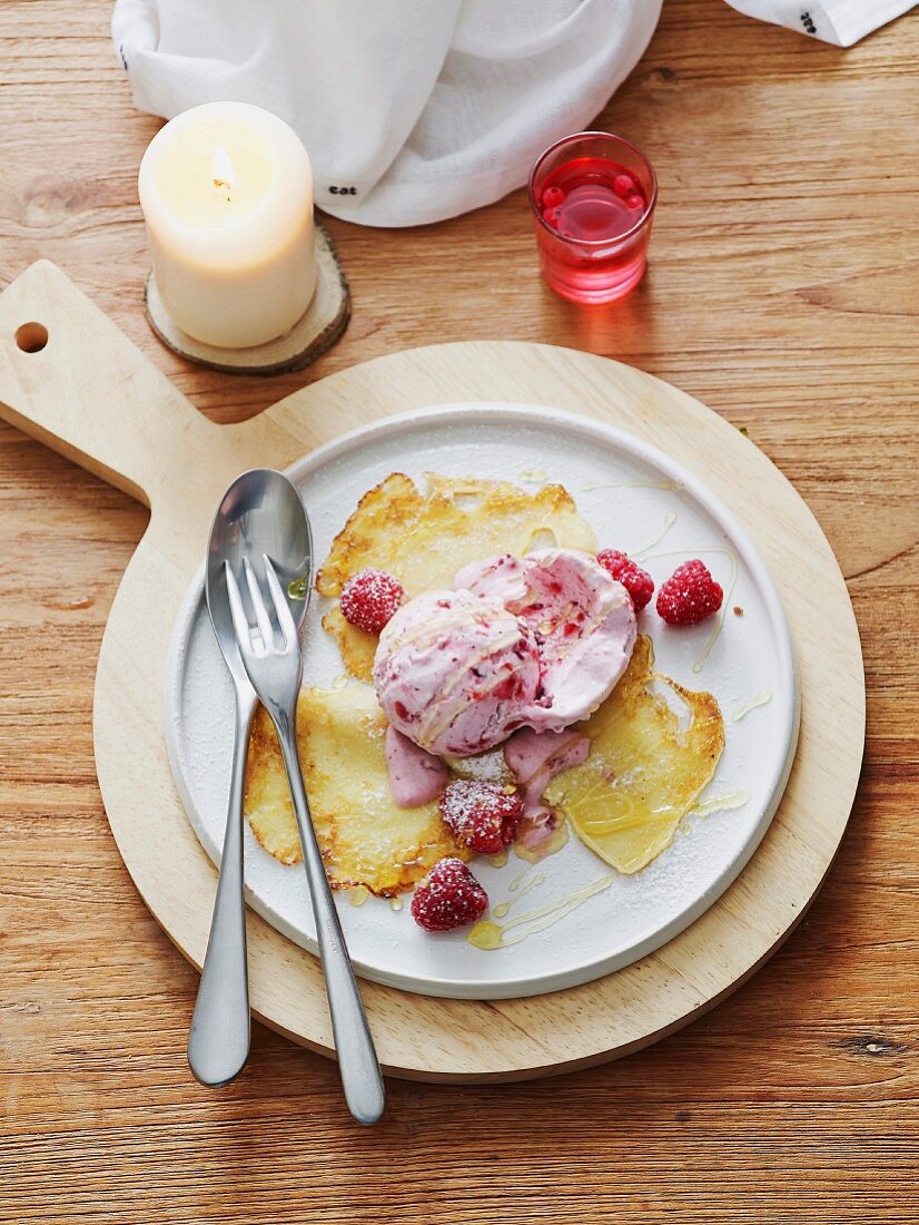 Lingonberry and cardamom ice cream with raspberries and Swedish pancakes