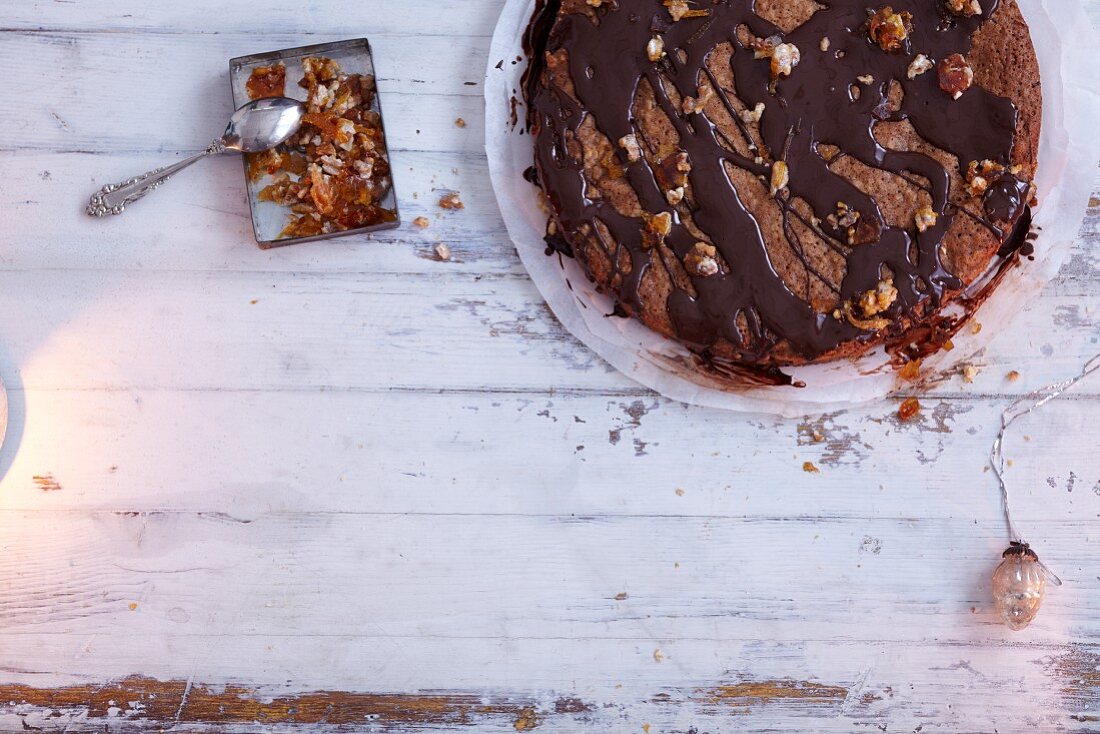 Honey cake with chopped nuts and chocolate glaze