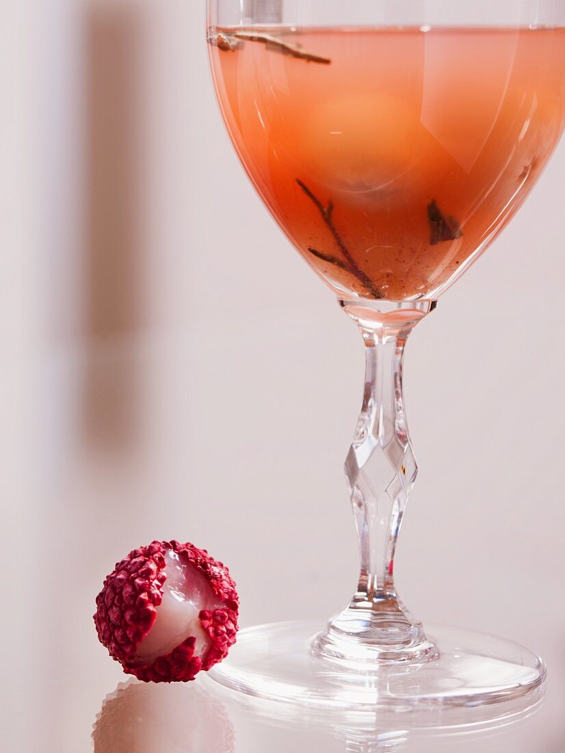 A white tea cocktail with rum and lychees