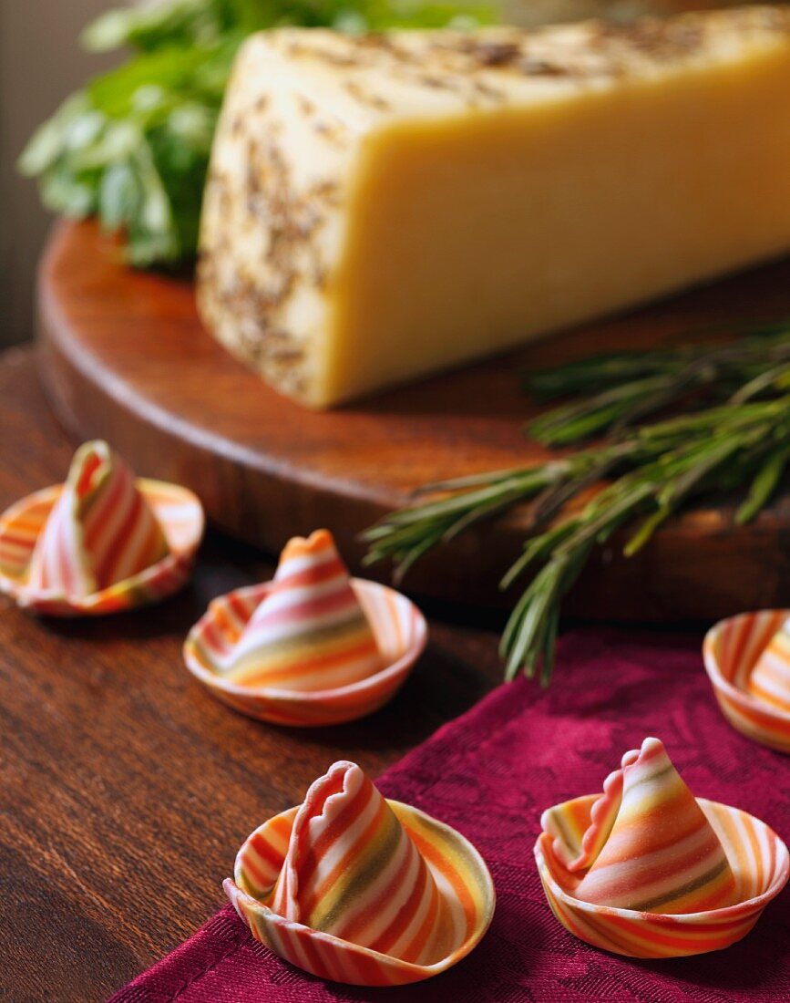 Pasta sombreros and a wedge of Assiago cheese