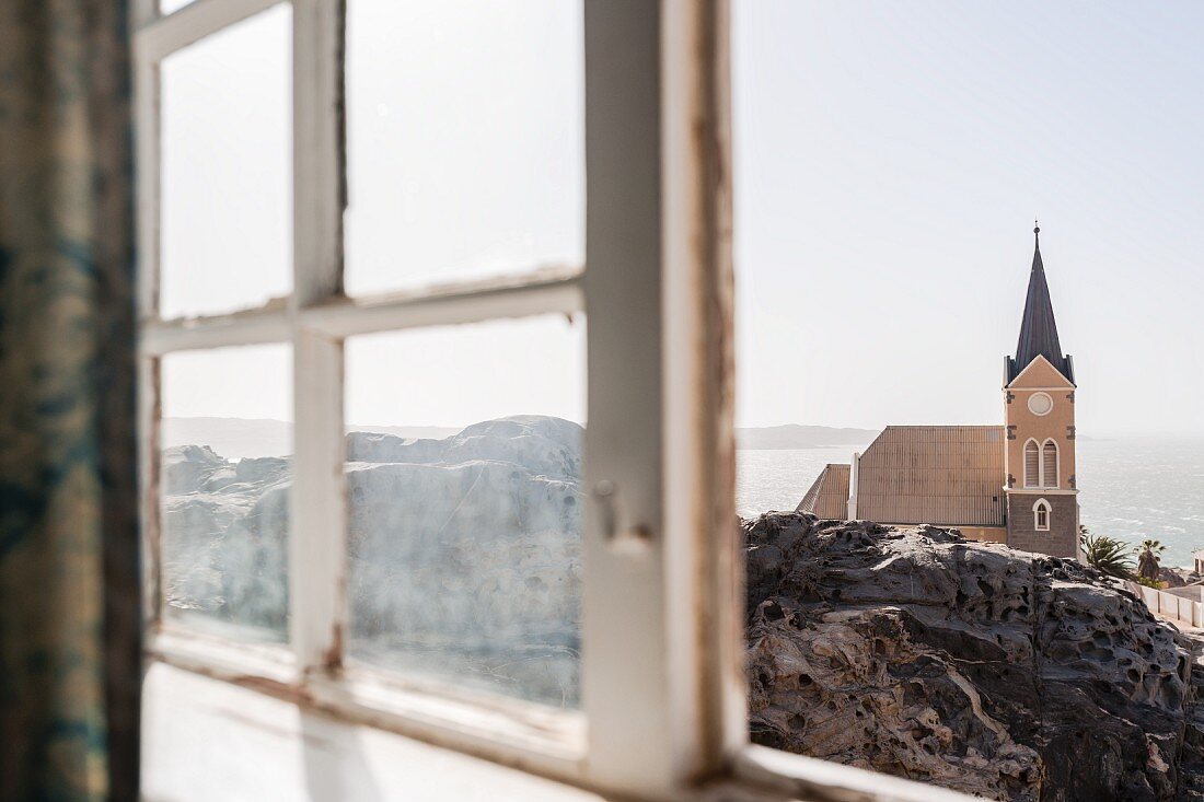 A view from the window of the Görke Haus looking towards the monolithic church on Diamantberg, Lüderitz, Namibia
