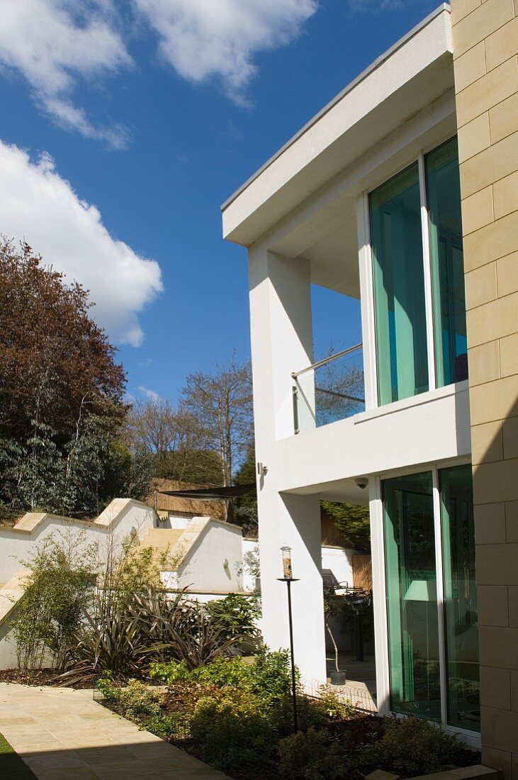 Glass facade of contemporary house in sunshine