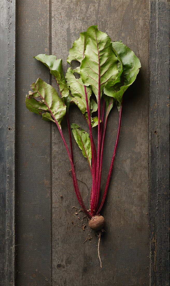 A beetroot on a wooden surface