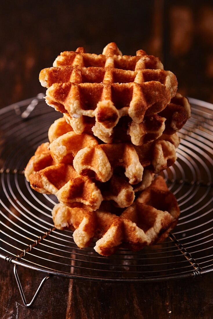 A stack of waffles on a wire rack