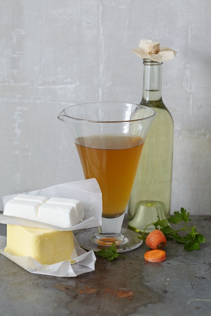 Different types of fat, stock and white wine for fondue