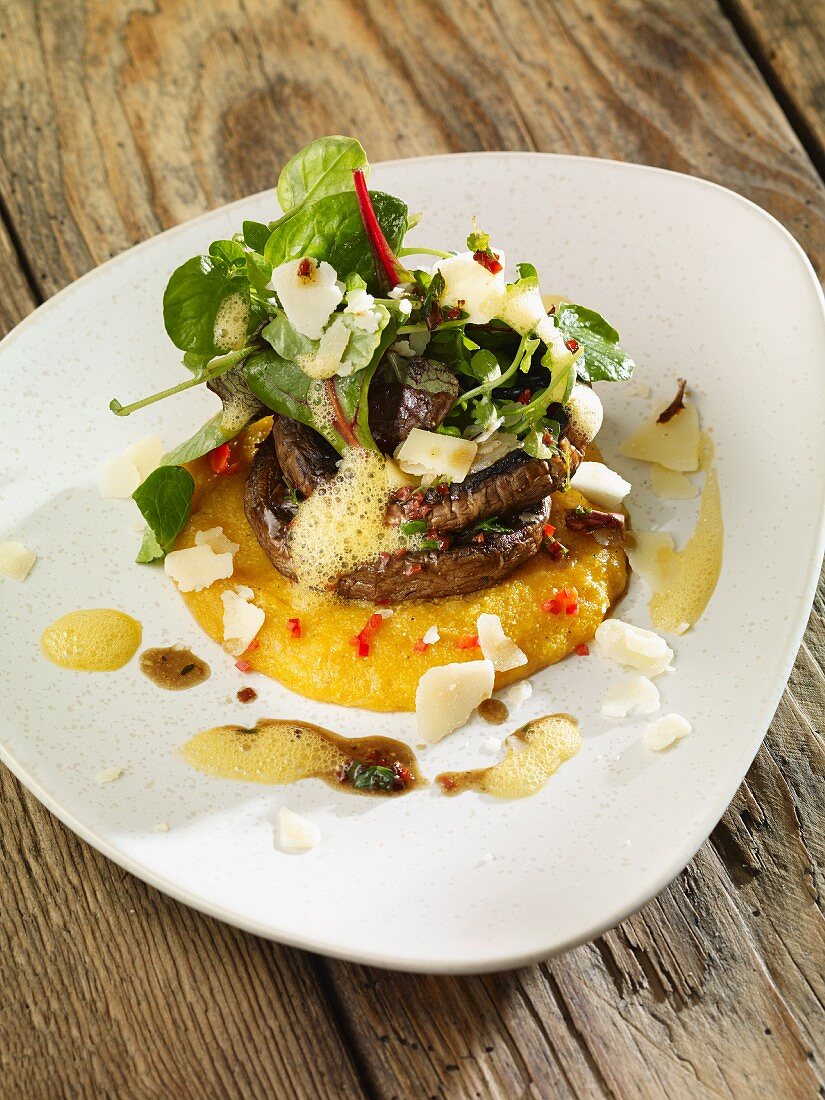 Grilled mushrooms on polenta with grated Parmesan