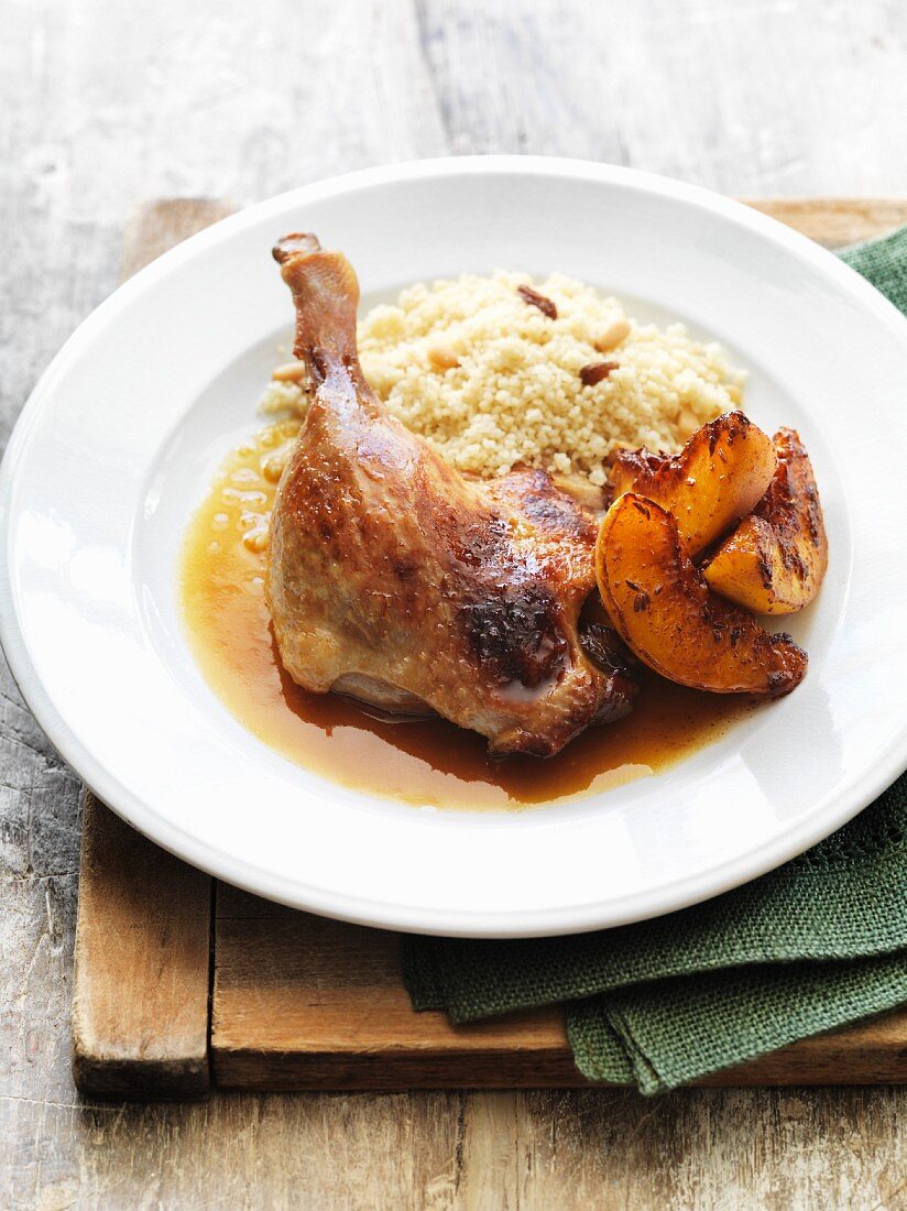 Slow-roasted duck with couscous and peaches