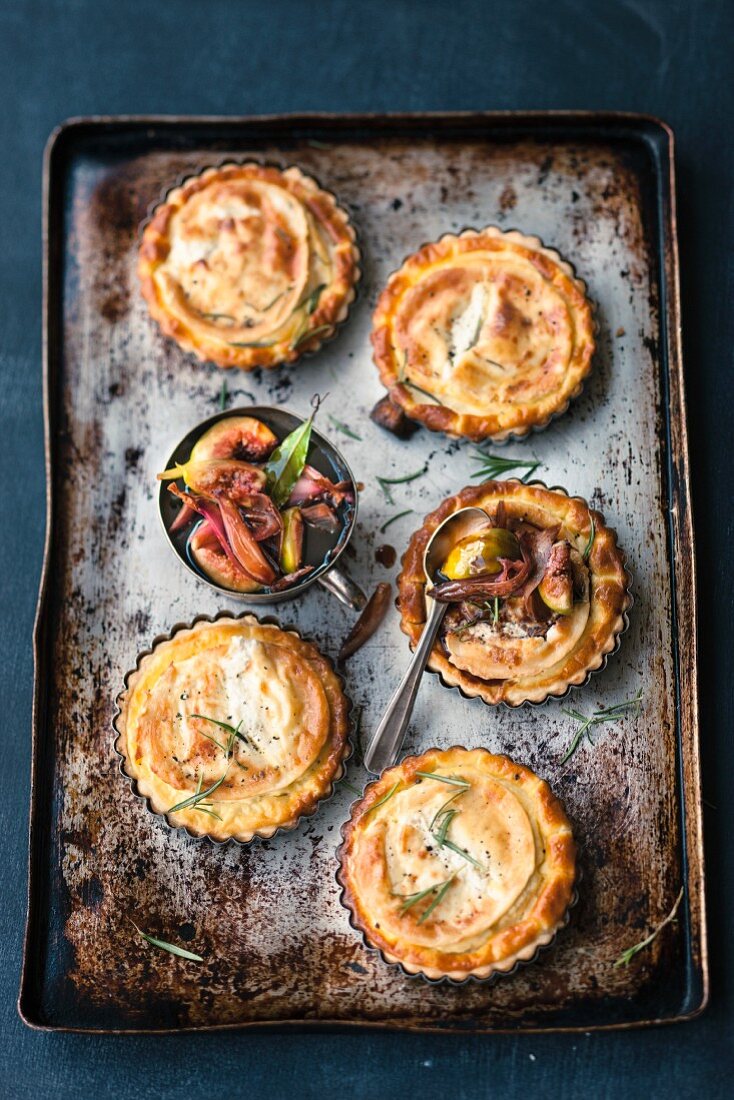 Goat's cheese tartlets on a baking tray