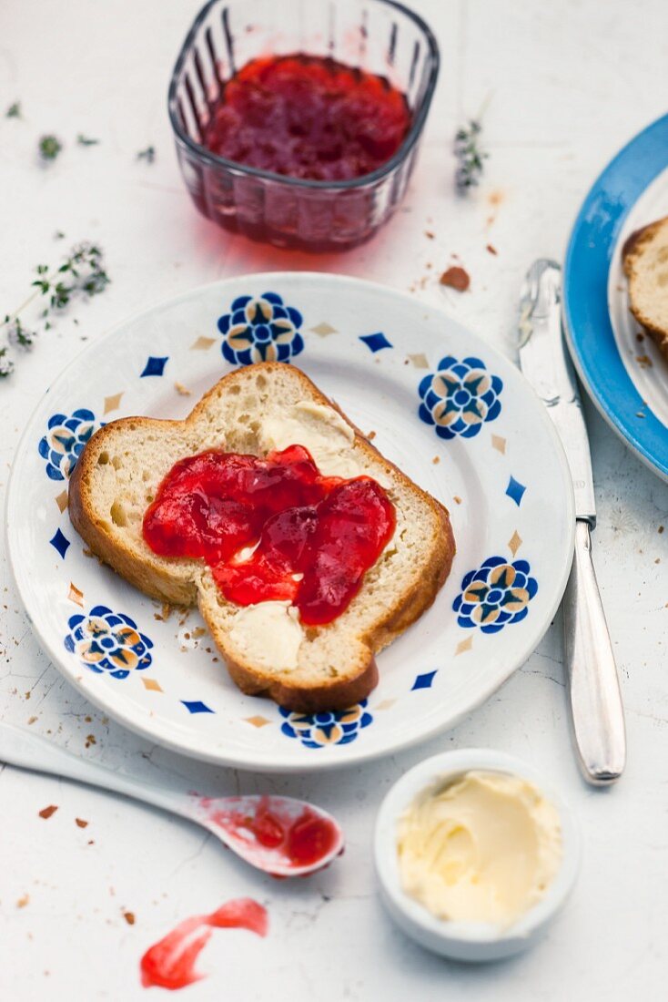 Strawberry jelly with thyme on a slice of white bread