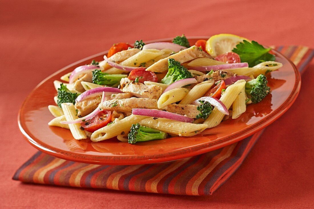 Penne with chicken, broccoli and red onions