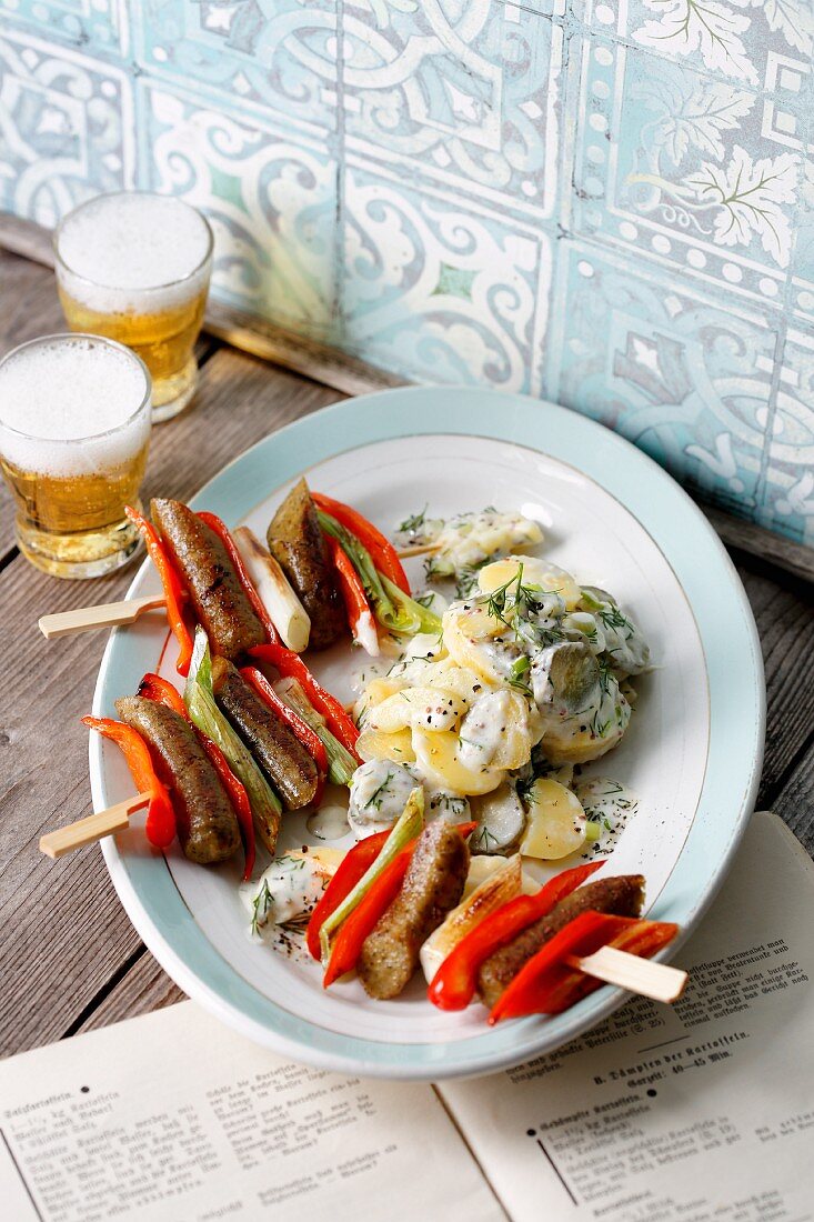 Tofu sausage skewers with peppers and spring onions