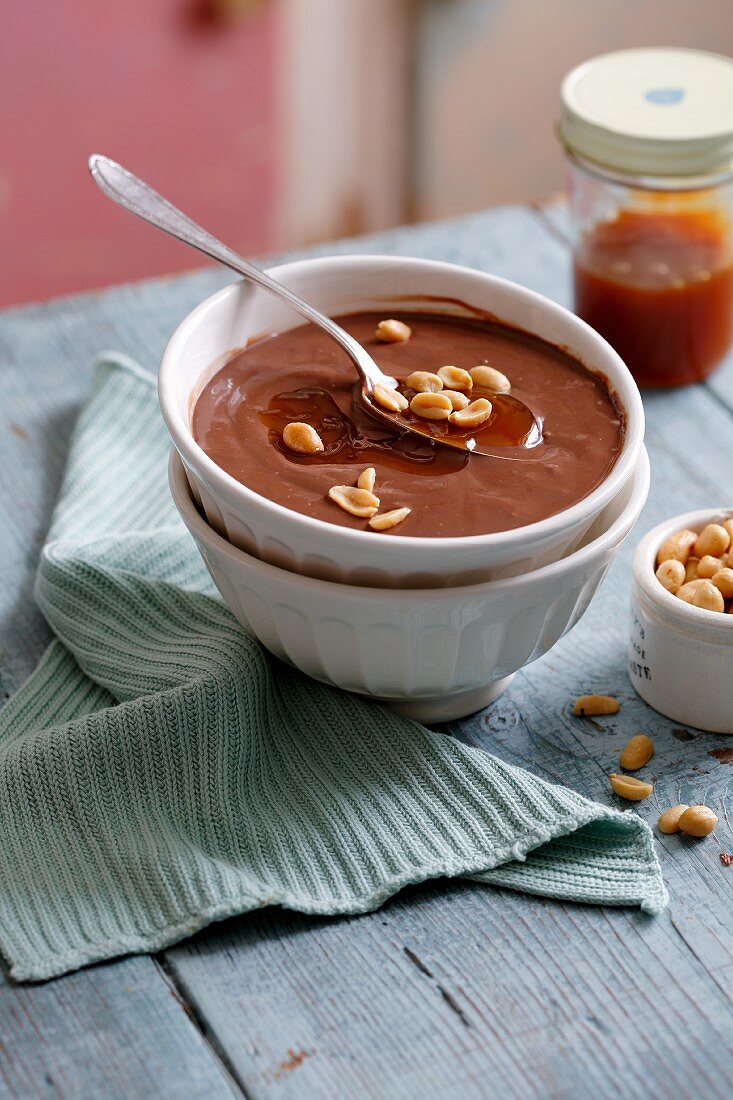 Chocolate pudding with caramel and peanuts