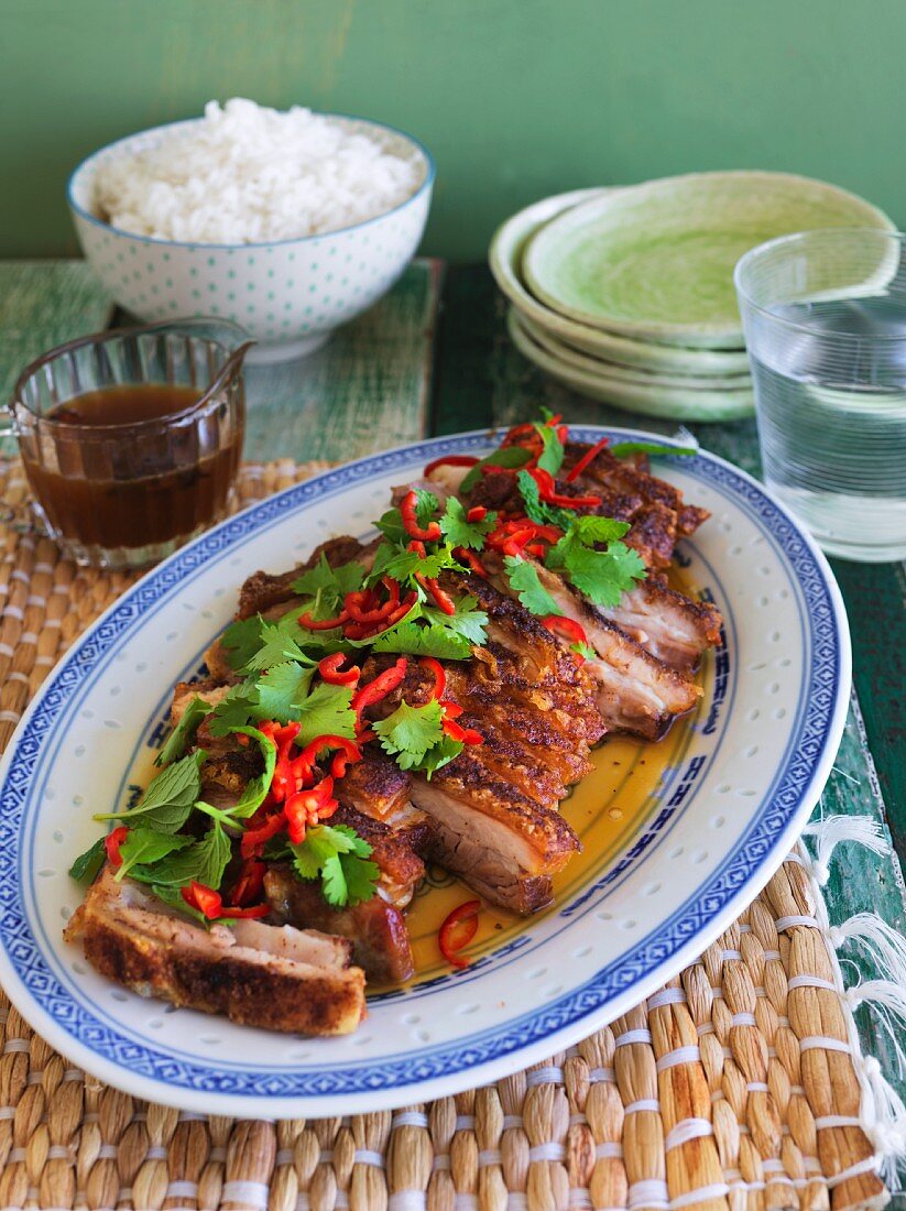 Spicy pork belly with chilli Peppers and coriander and a side of rice (China)