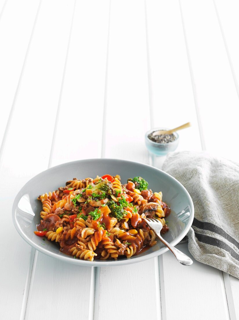 Fusilli pasta with vegetables, mushrooms and parsley