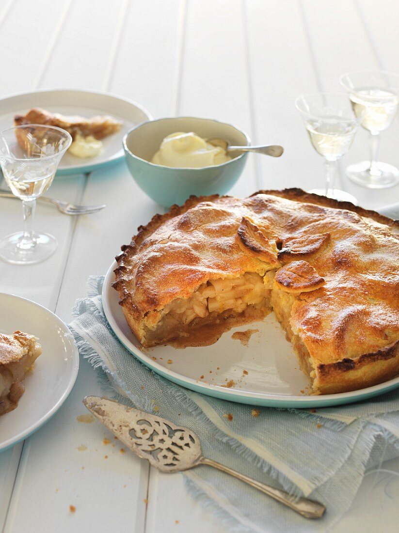 Apple pie, sliced, with cream