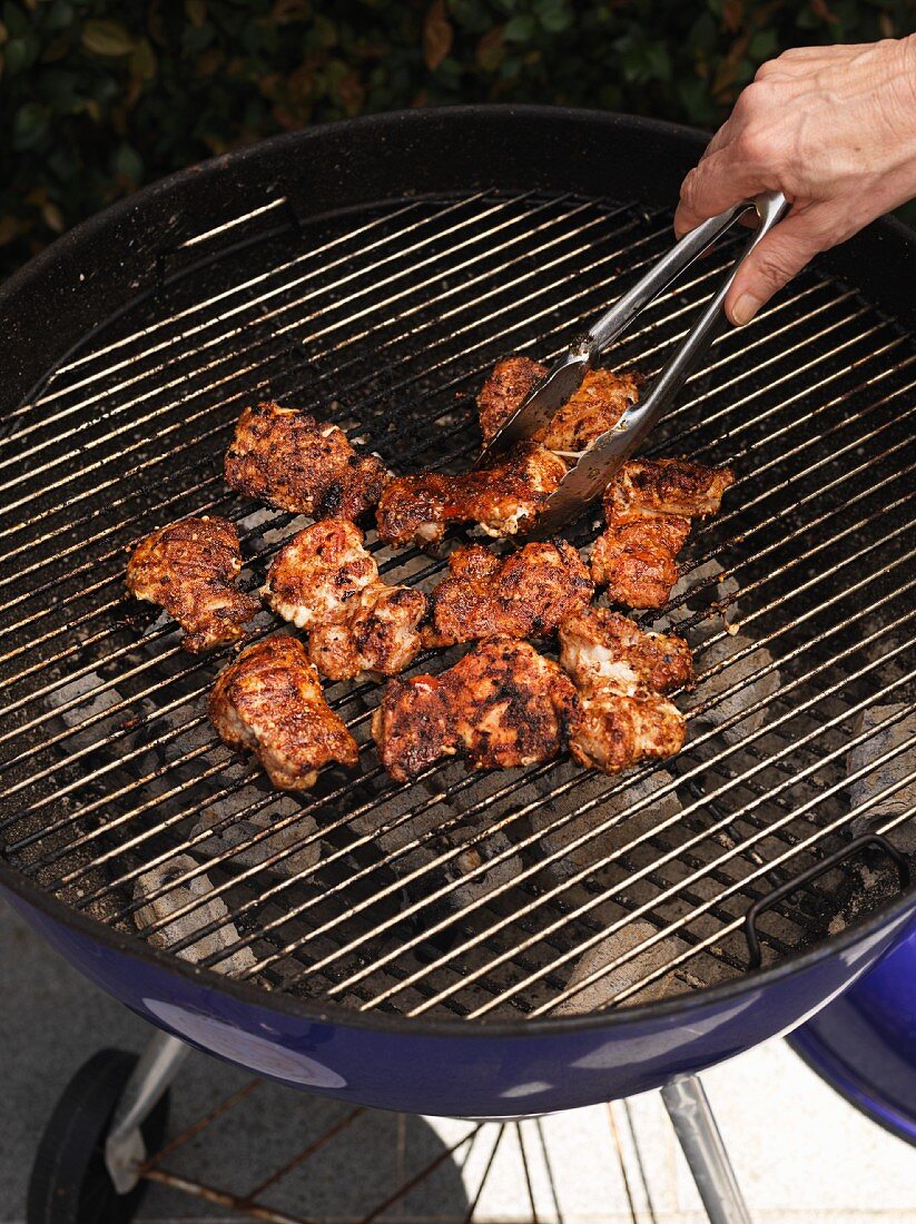 Chicken bits on a barbecue