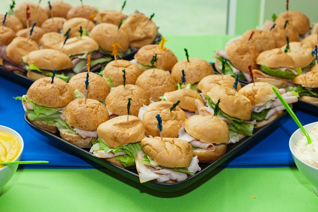 Turkey sandwiches with iceberg lettuce on trays