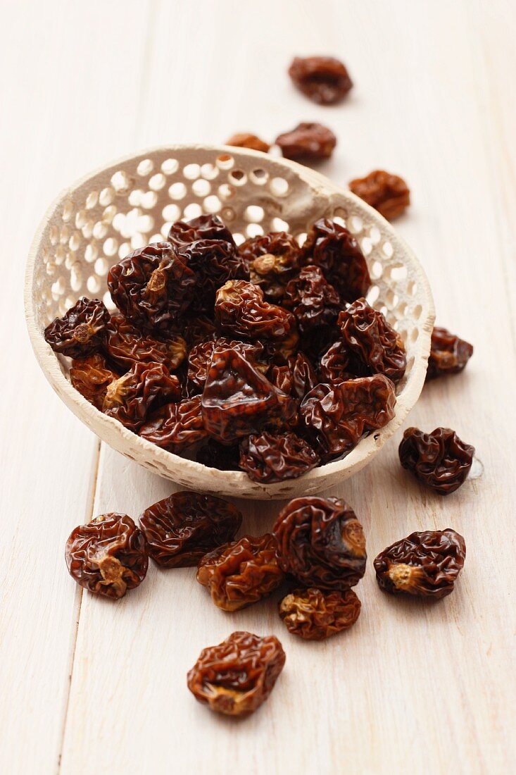 Dried cape gooseberries in a decorative container