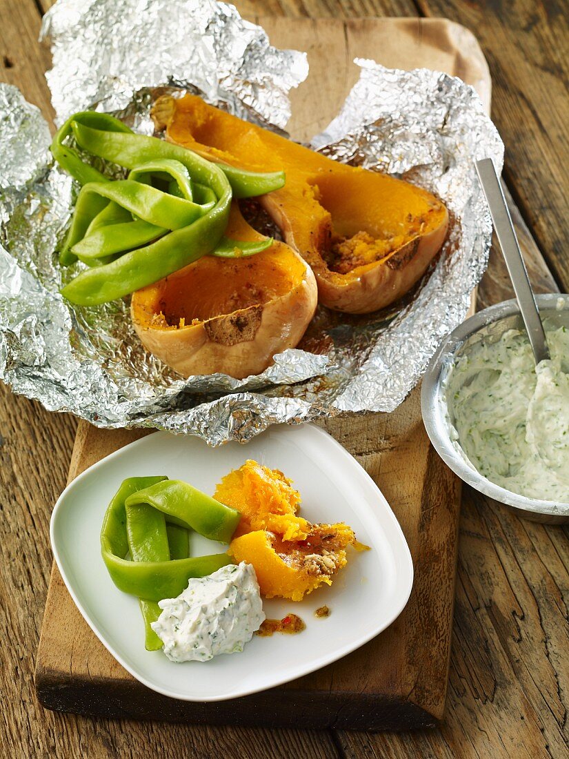 Baked butternut squash with beans and quark cream