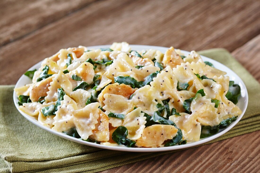Farfalle pasta with a chicken and spinach sauce