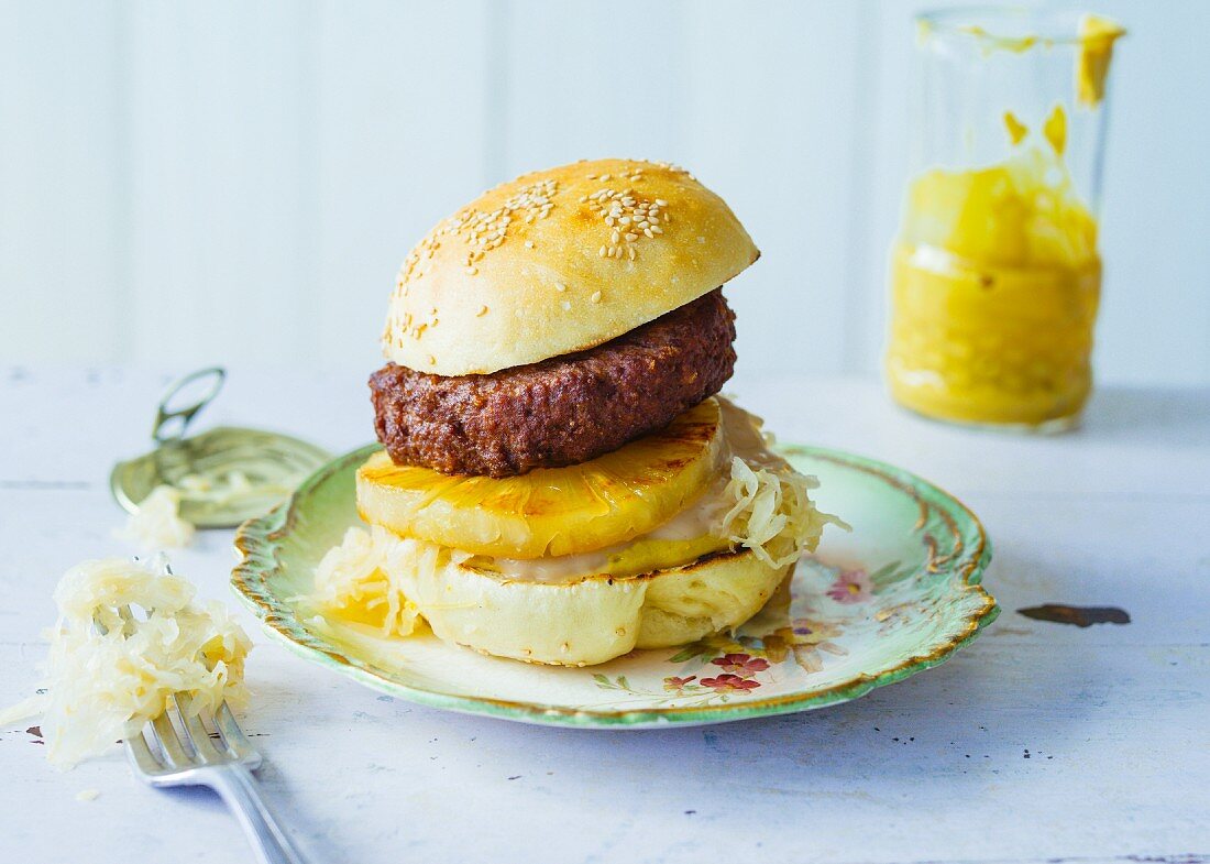 A Sunday burger with pineapple and white cabbage