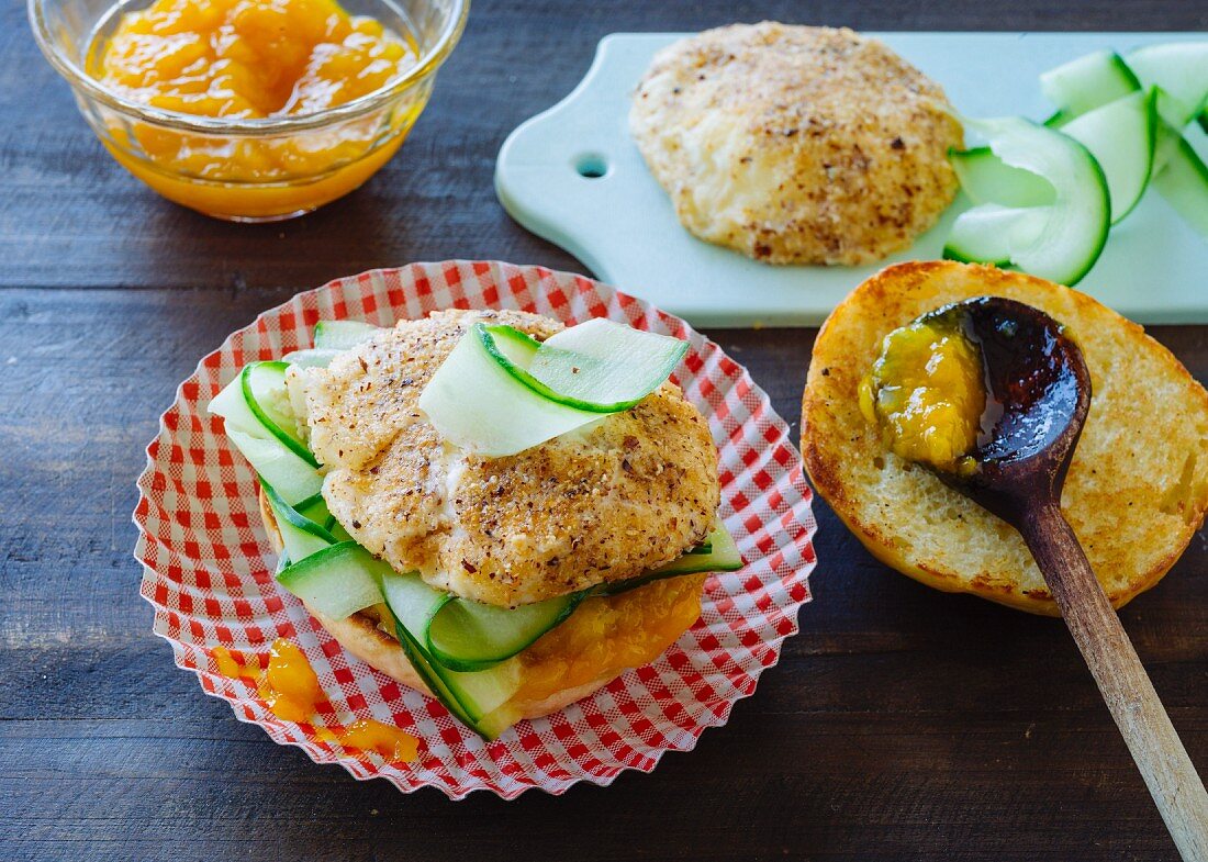 A burger with breaded mozzarella, cucumber and mango chutney