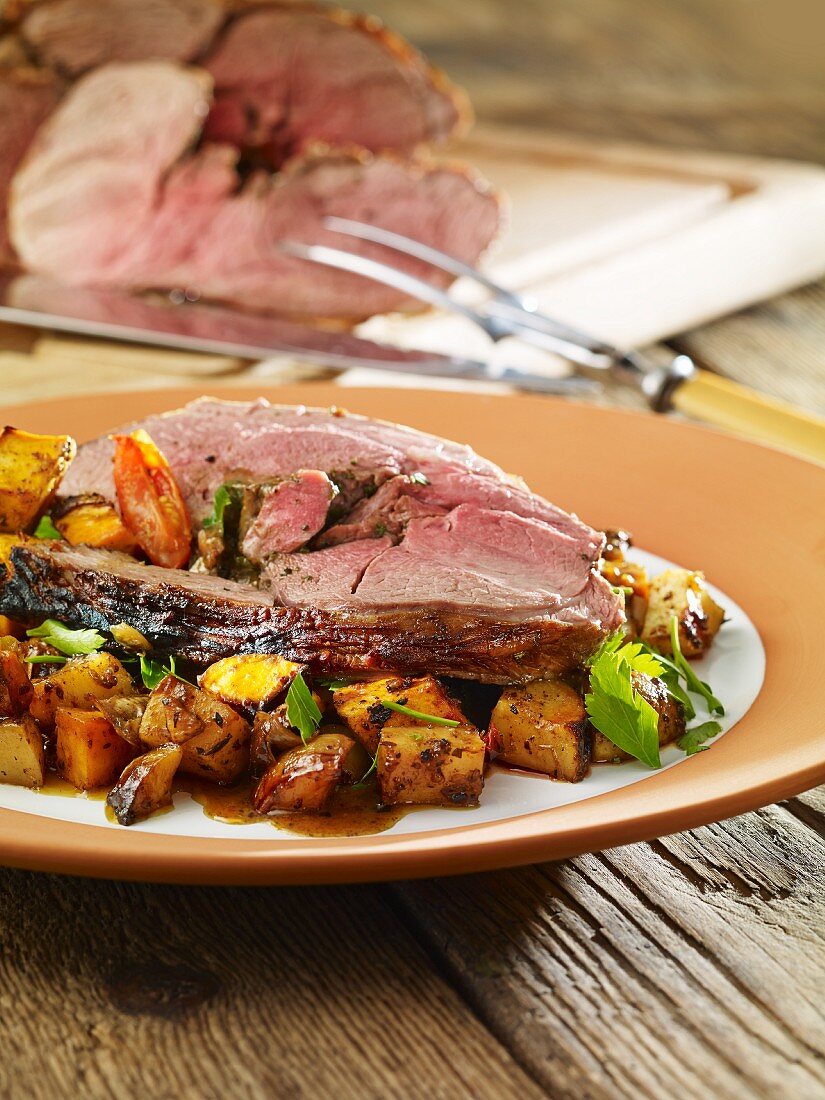 Leg of lamb with potatoes and courgette