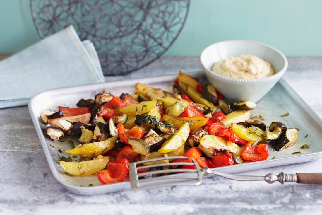 Oven-roasted vegetables with hummus
