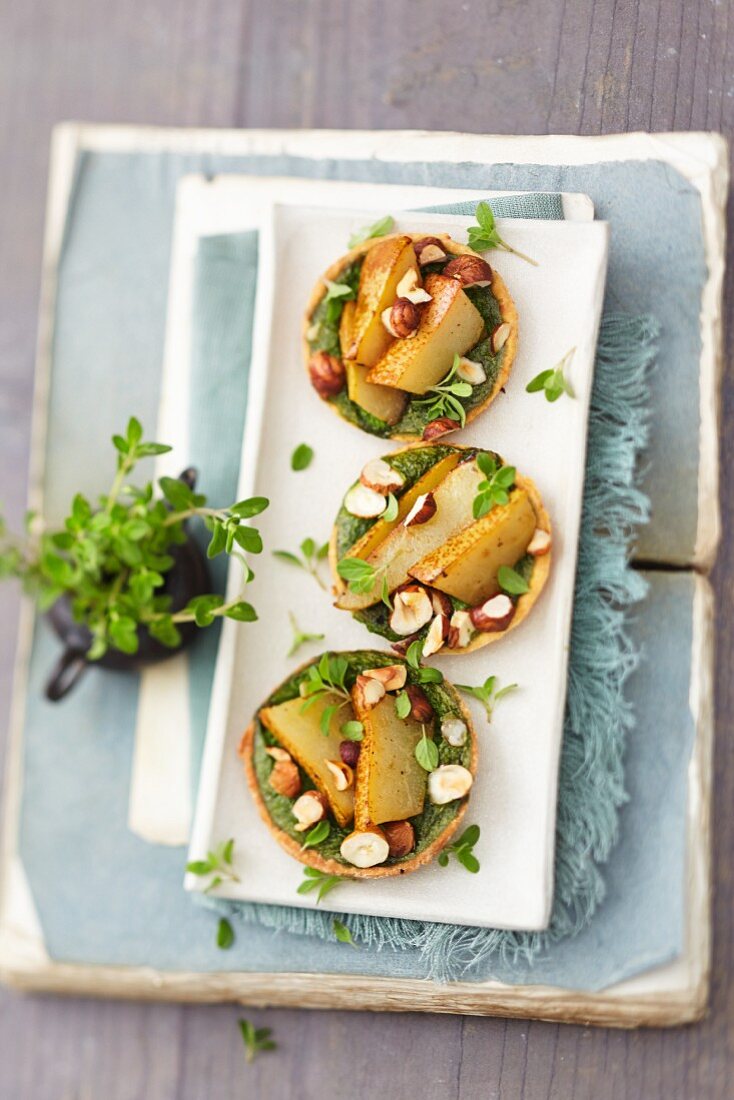 Pear and hazelnut tartlets with a herb topping