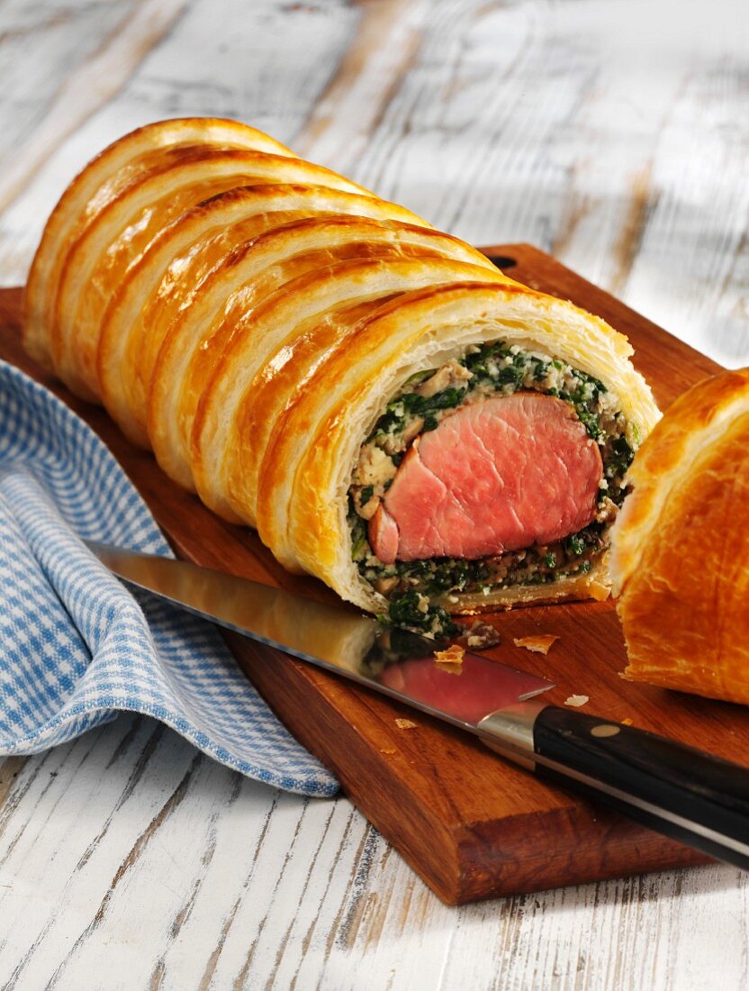 Pork fillet wrapped in puff pastry with spinach and breadcrumbs