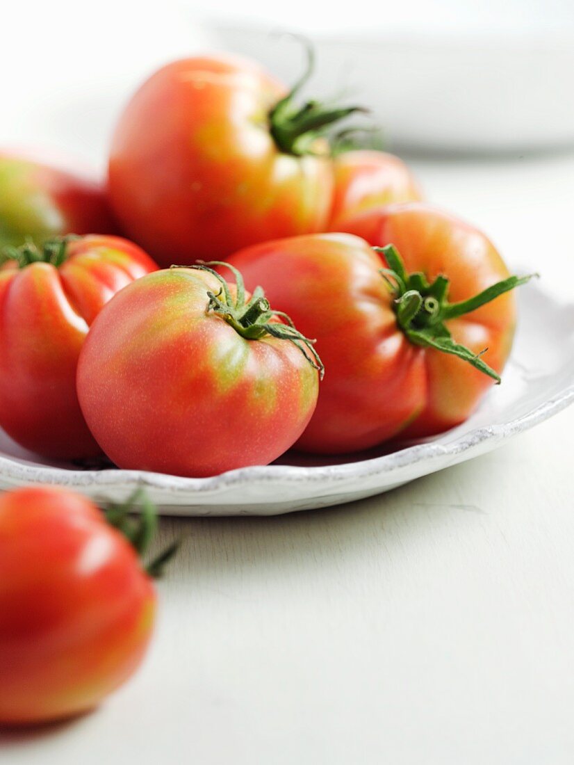 Tomatoes on a white plate