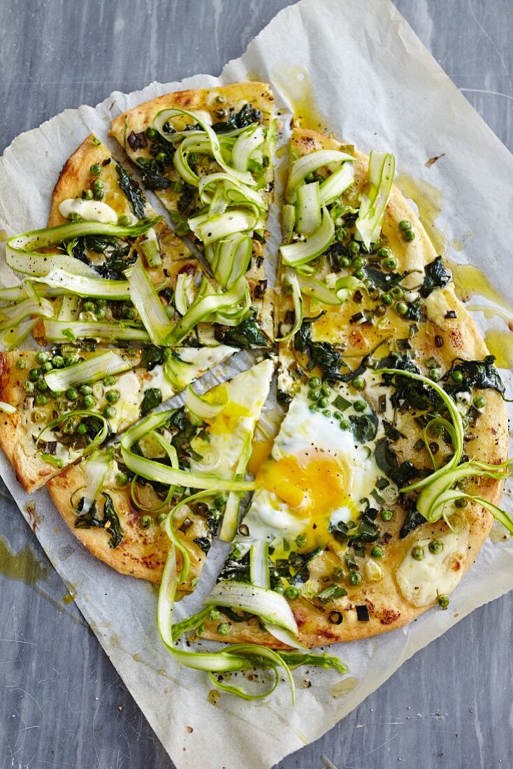 Pizza Primavera with asparagus, peas and fried egg