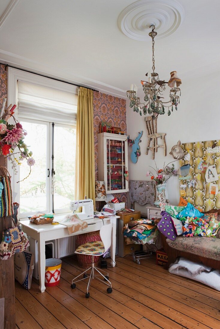 Mix of patterns and styles in colourful, jumbled sewing room