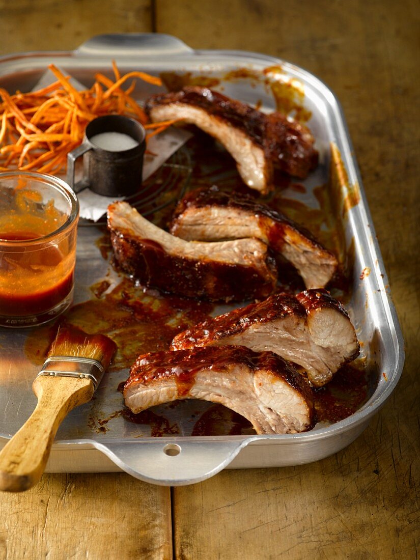 Spare ribs with a tangy honey BBQ sauce served with sweet potato fries and salt