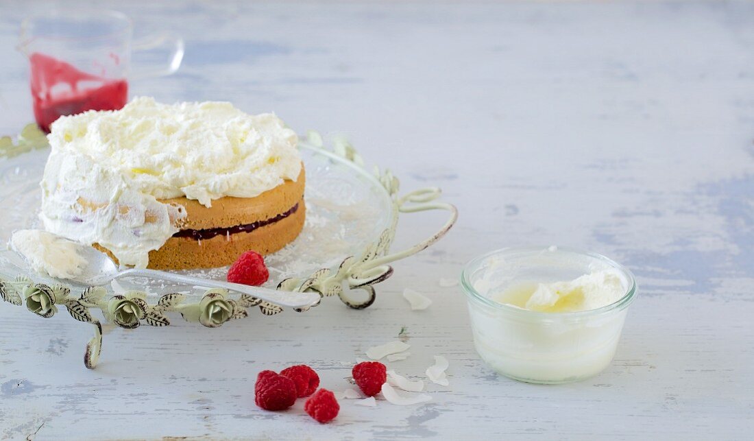 A mini raspberry layer cake with cream