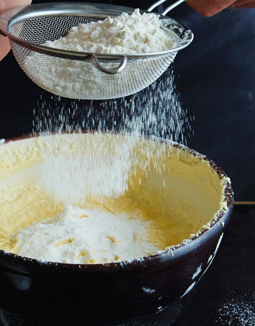 Flour being sieved