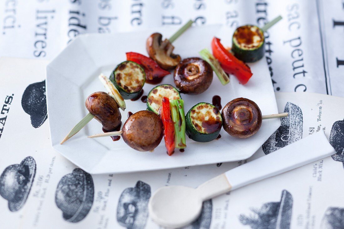 Oriental vegetables skewers with mushrooms cooked on a hot stone