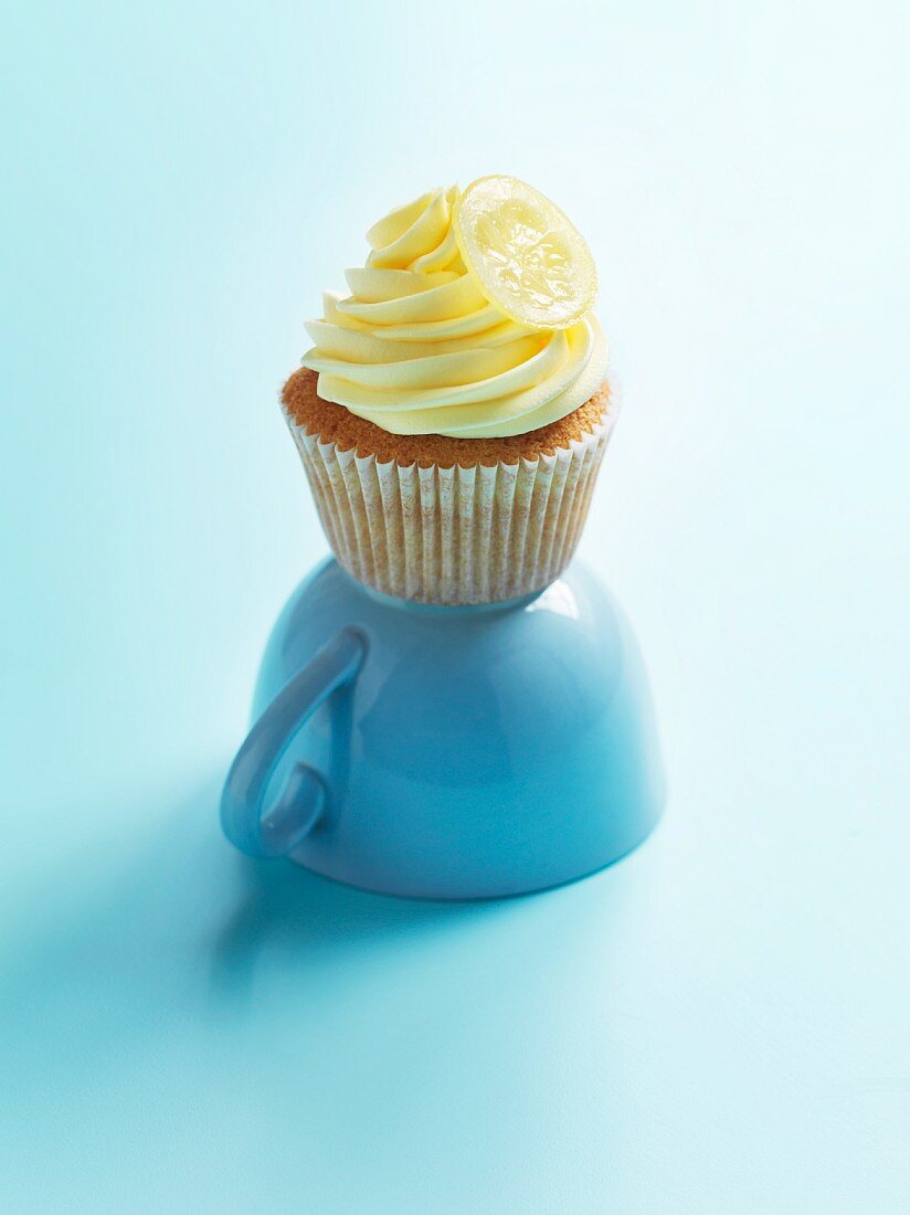 A cupcake decorated with lemon cream