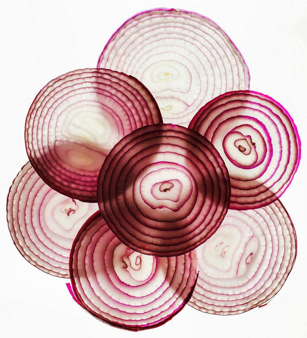 Black lit slices of red onion