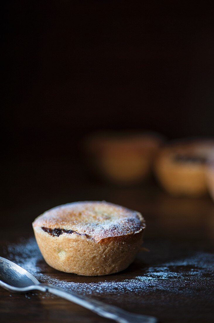 A mince pie dusted with icing sugar for Christmas