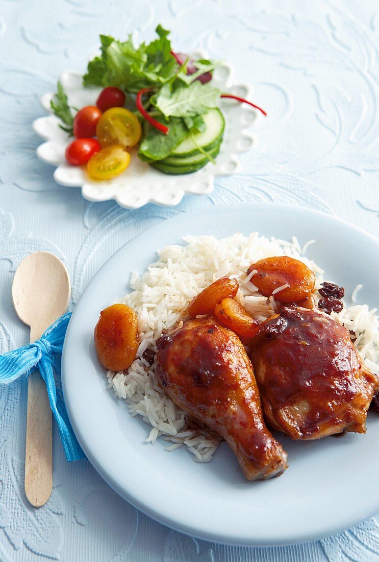 Braised chicken in a cola and tomato sauce with dried apricots and rice