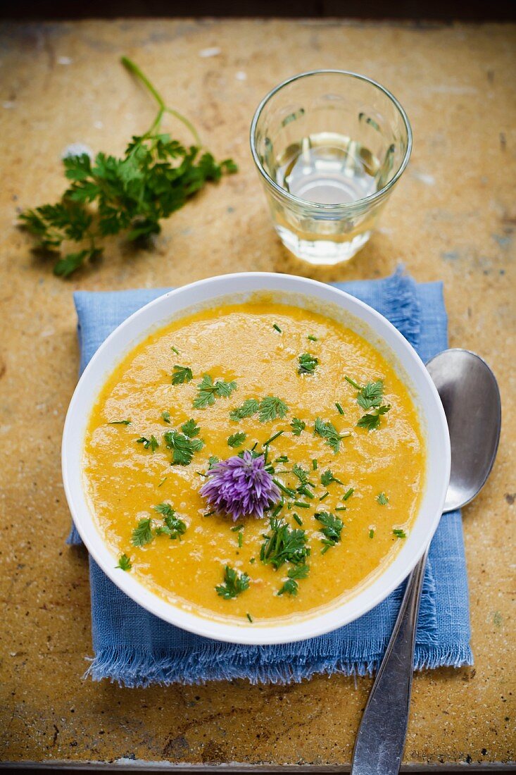 Carrot soup with chervil and chive flowers
