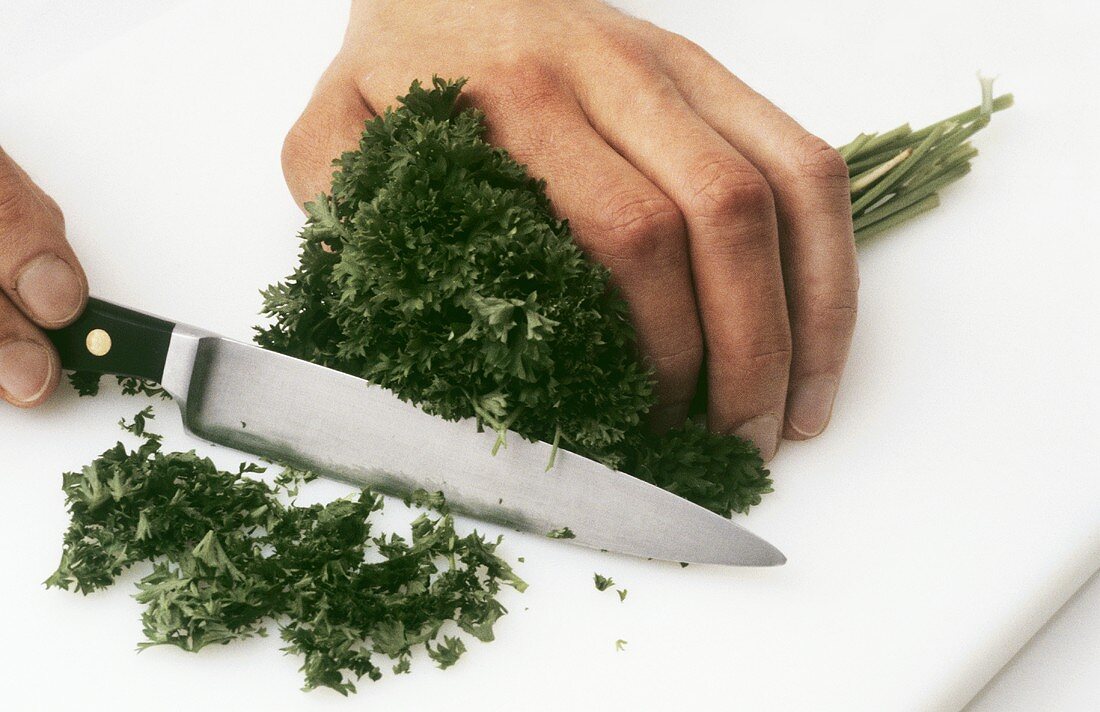 Chopping curly leaf parsley