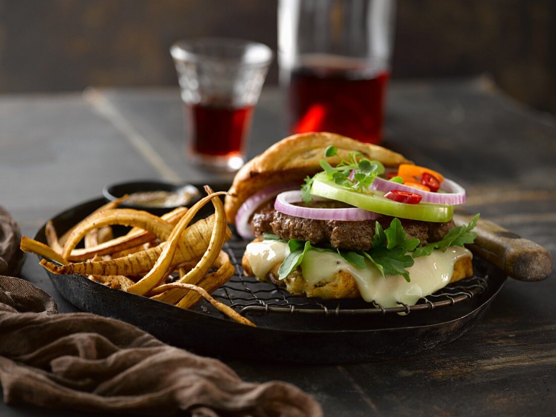 A cheeseburger with brie, onions and fried parsnips