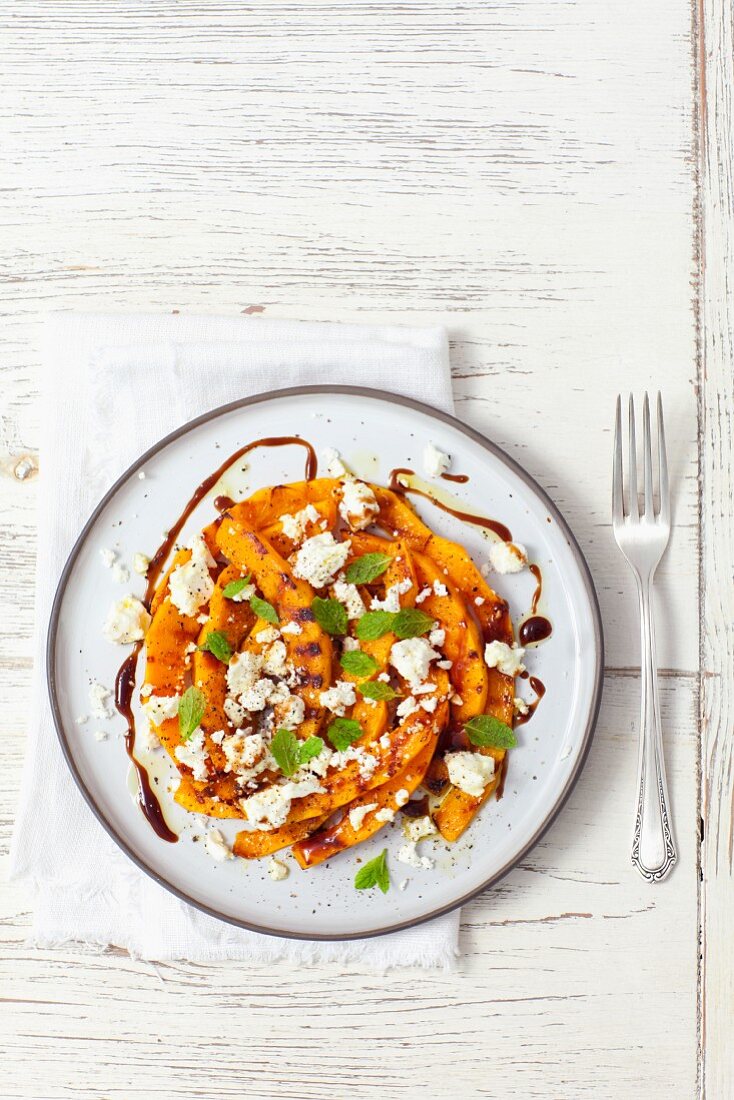 Grilled pumpkin with feta cheese and balsamic dressing