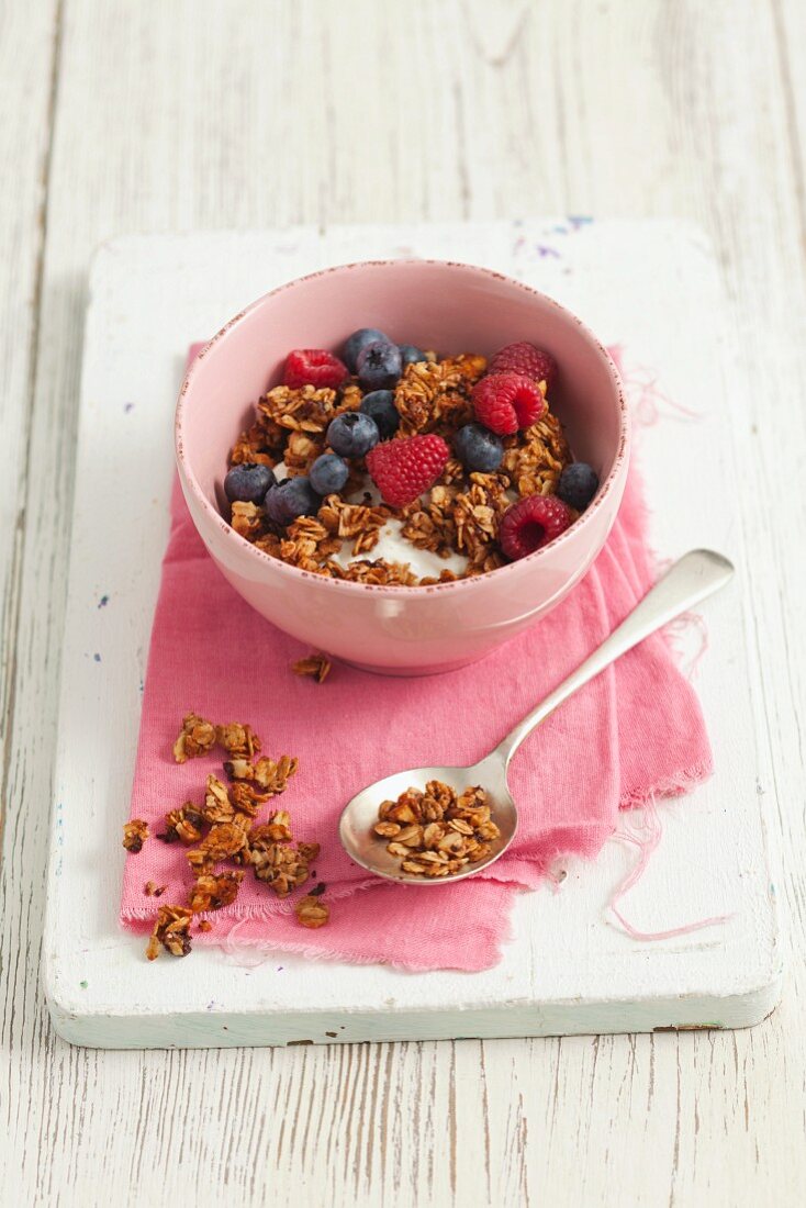 Chocolate and nut muesli with yogurt and berries