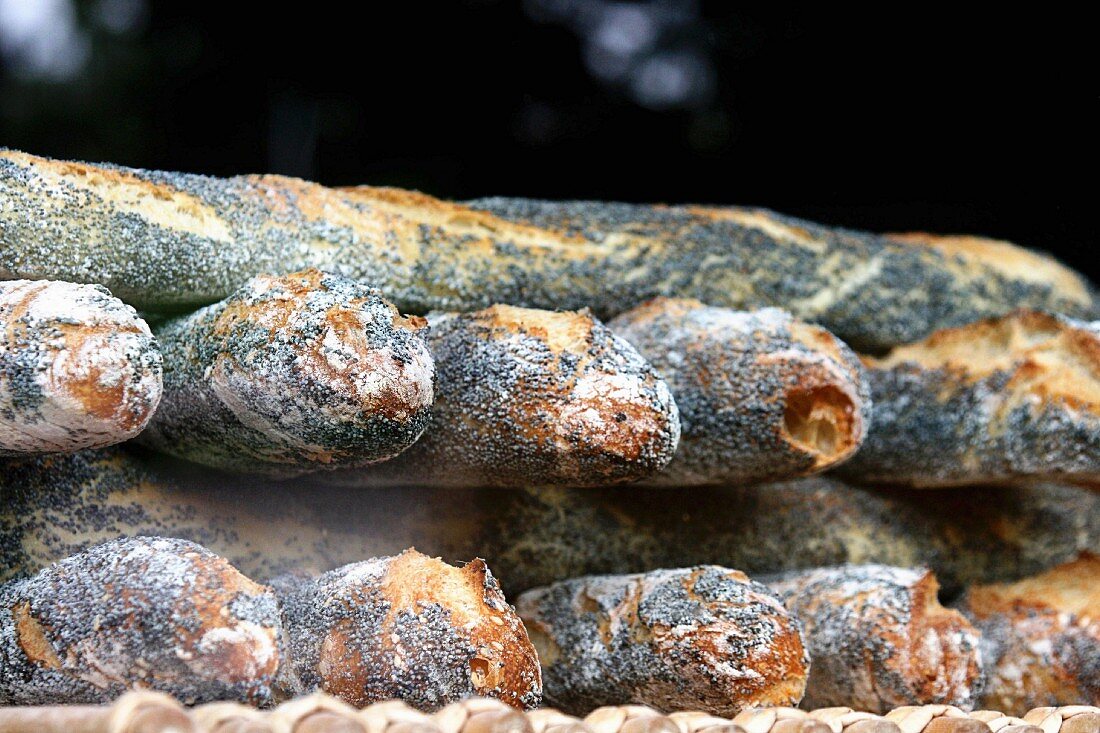 A stack of poppy seed baguettes